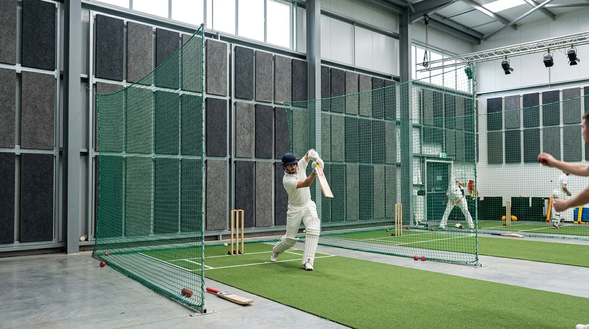 Acoustic panels for indoor cricket net training facilities