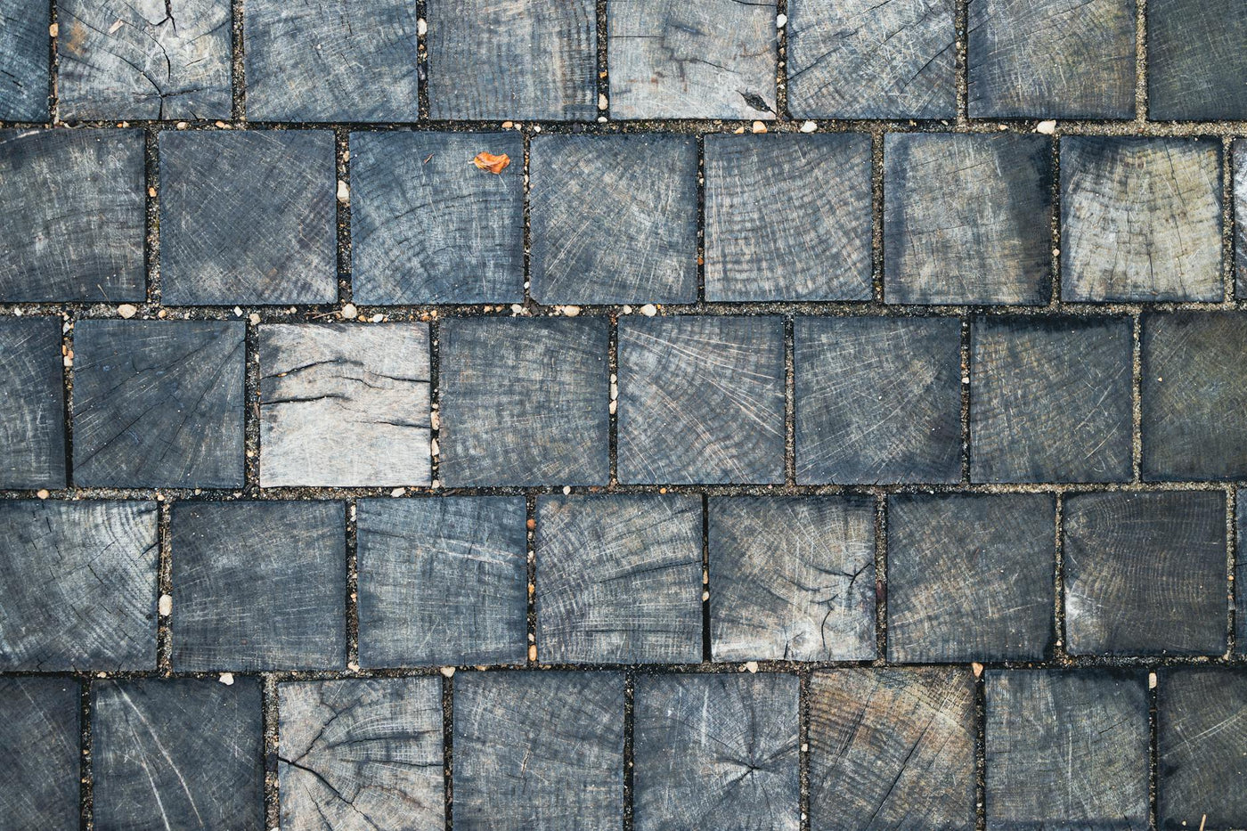 Top view of rustic wooden tiles forming an abstract geometric pattern.