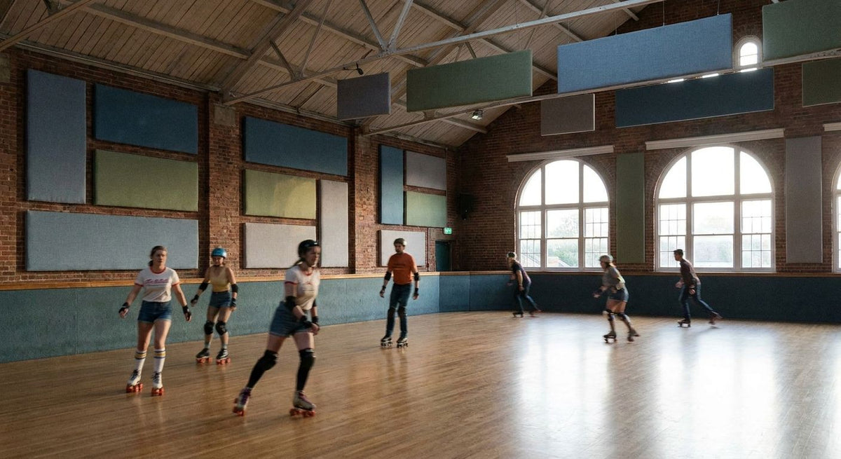 Acoustic panels for indoor roller skating rinks