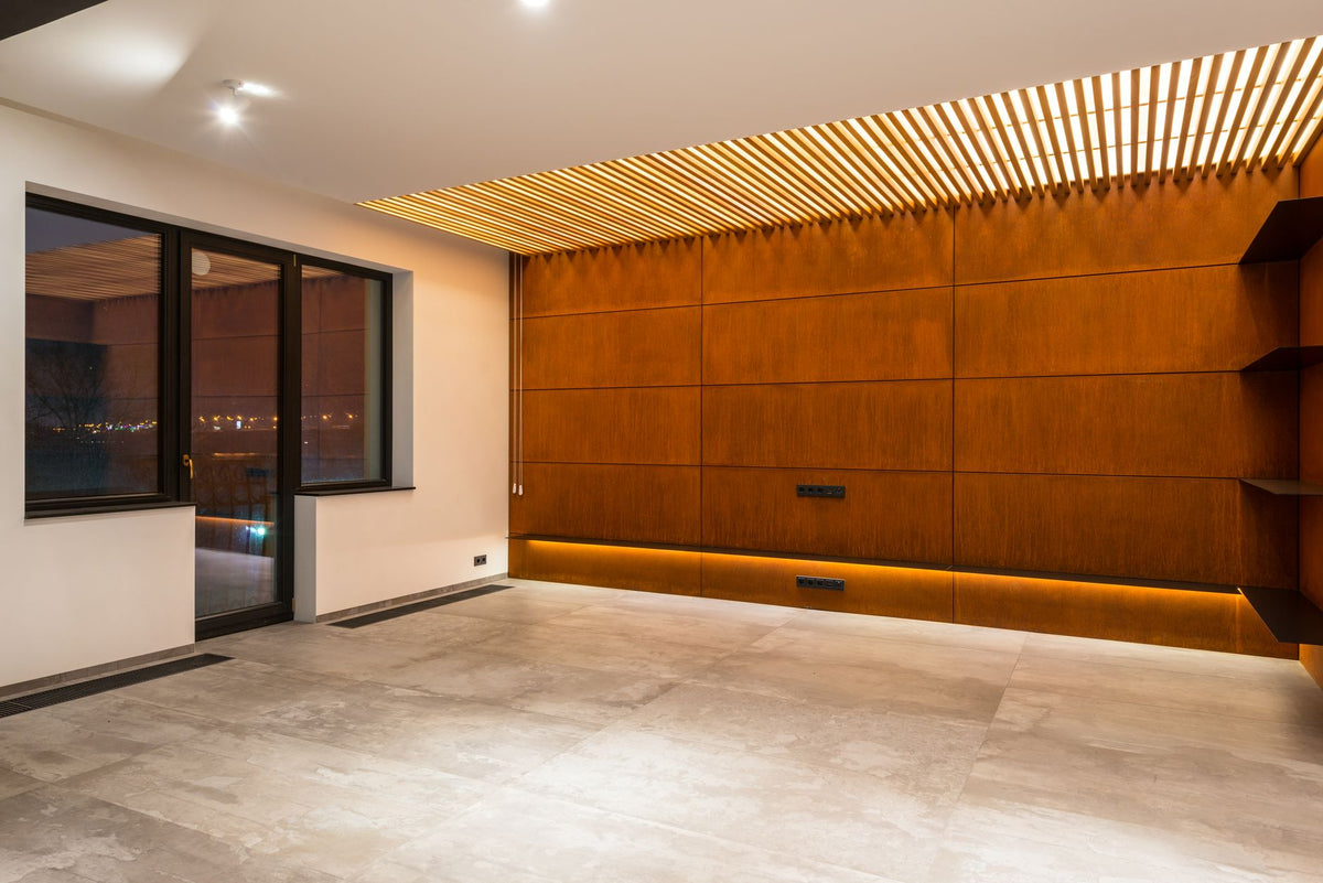 Contemporary spacious empty corridor interior with wooden panels and shelves against windows in light house
