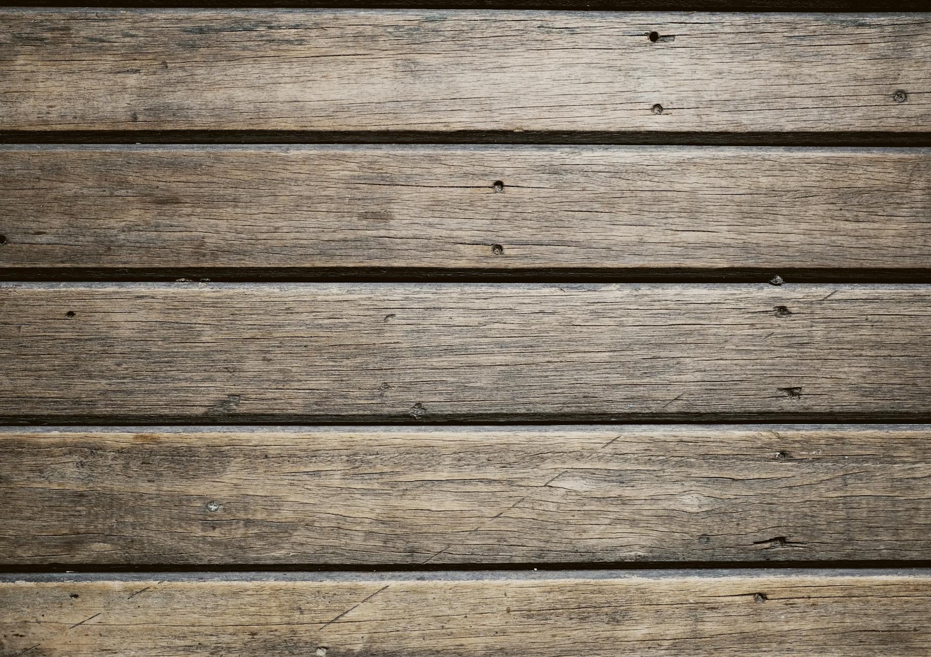 Detailed rustic wooden planks texture, ideal for background or surface designs.