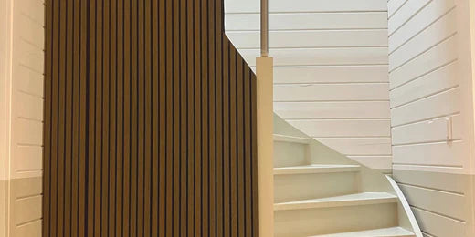 Staircase with slat wall panels